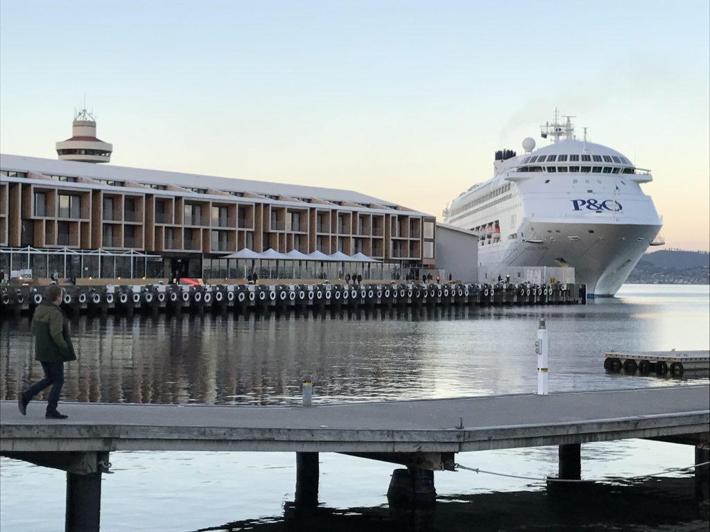 A cruise ship docked beside MACq 01 Hotel in Hobart